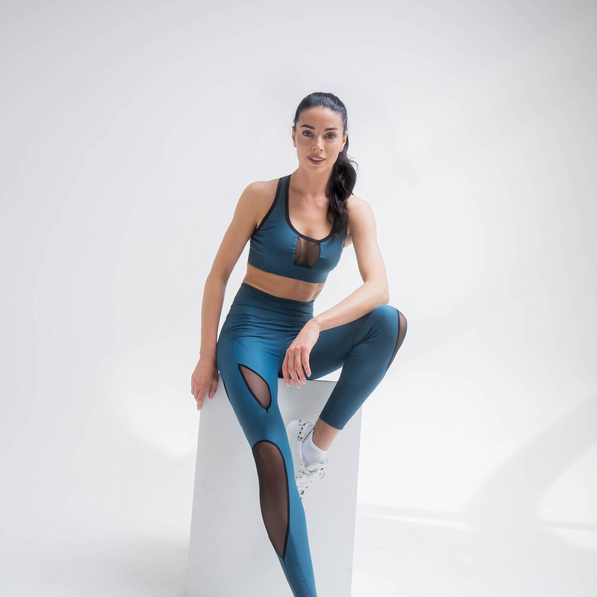 Indigo Thalassa mesh blue activewear bra top with breathable fabric and sleek design, perfect for workout and fitness activities.