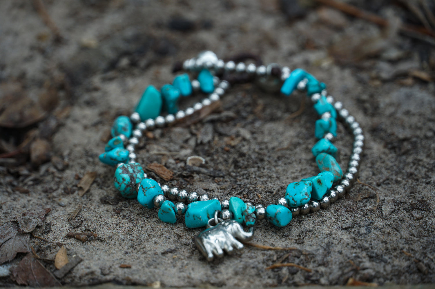 Silver stone boho elephant bracelets by Tan Smokey, featuring intricate elephant and floral designs on adjustable silver bands.