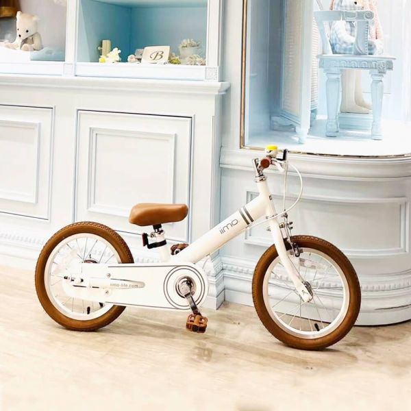 Purple Phaedra iimo 2-in-1 14-inch balance bike and pedal bike for kids, featuring a sleek purple frame and adjustable handlebars.