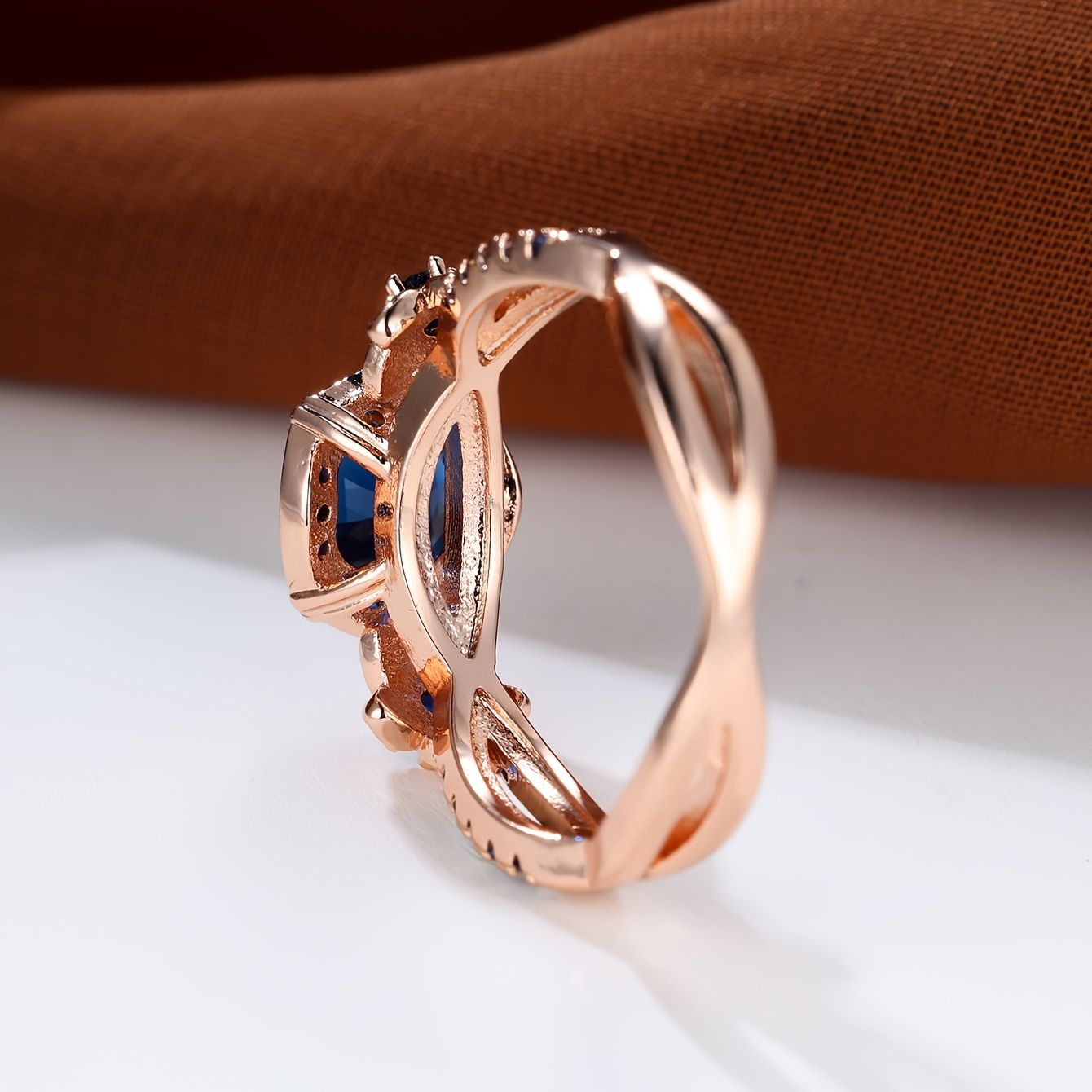 Carmine Medusa sapphire ring featuring a large deep blue sapphire gemstone set in a stylish silver band.