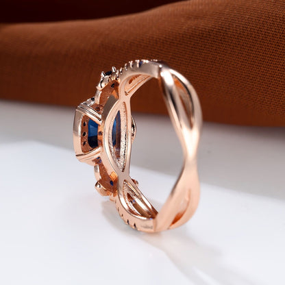 Carmine Medusa sapphire ring featuring a large deep blue sapphire gemstone set in a stylish silver band.