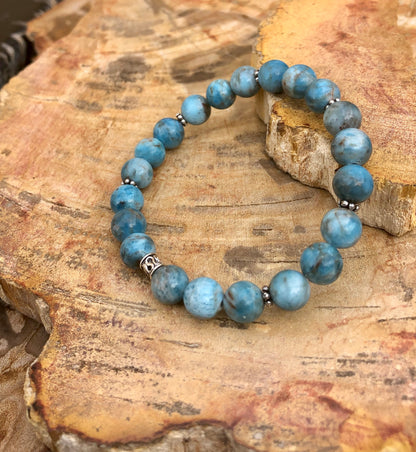Blue Apatite gemstone bracelet with stretch design from Violet Chaos, featuring polished round beads on a flexible elastic band.