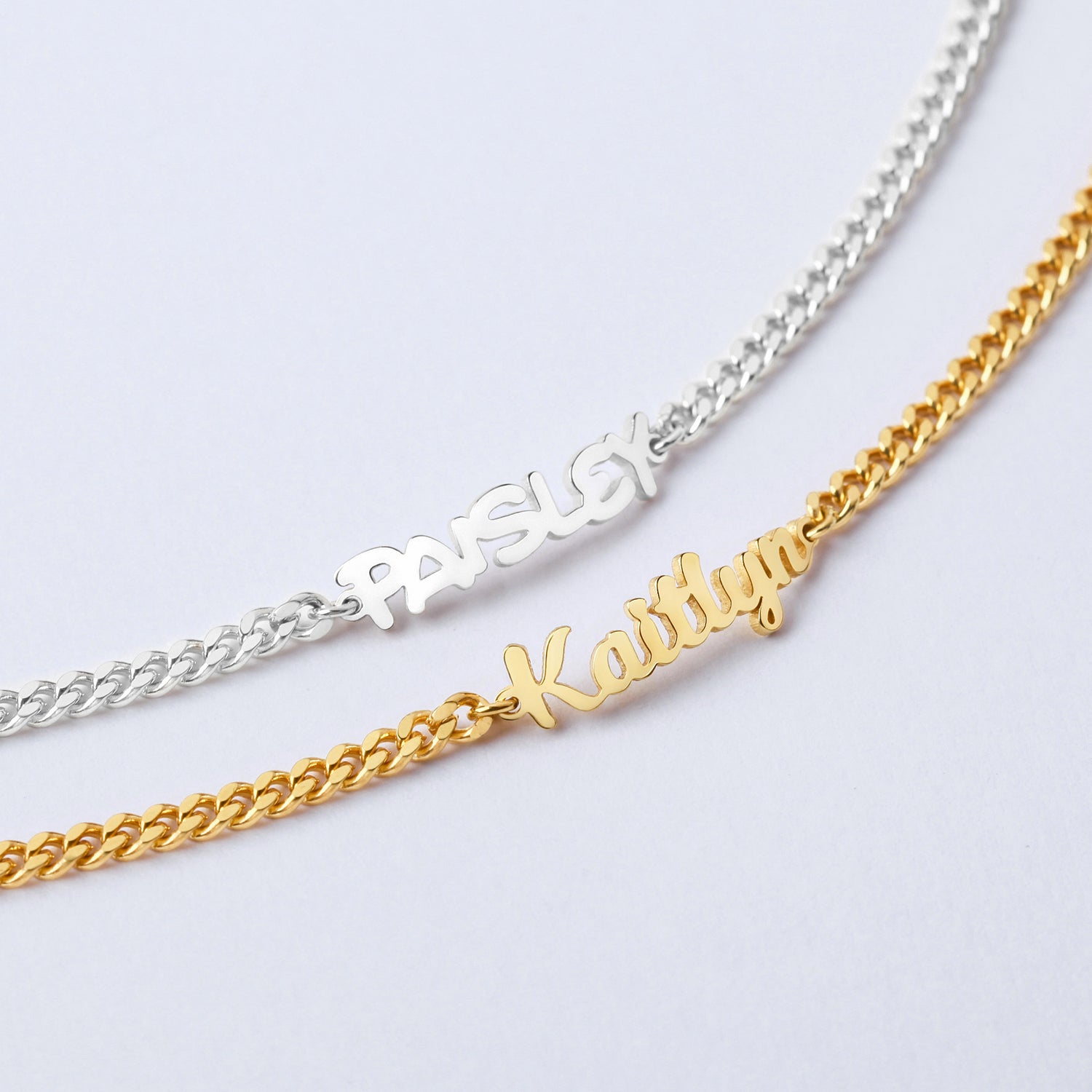 Green Millie child name bracelet for girls featuring personalized baby name jewelry on a delicate bracelet.