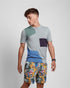 Violet Castor multicolored crew neck short sleeve knit tee with an art deco pattern, featuring vibrant geometric designs.