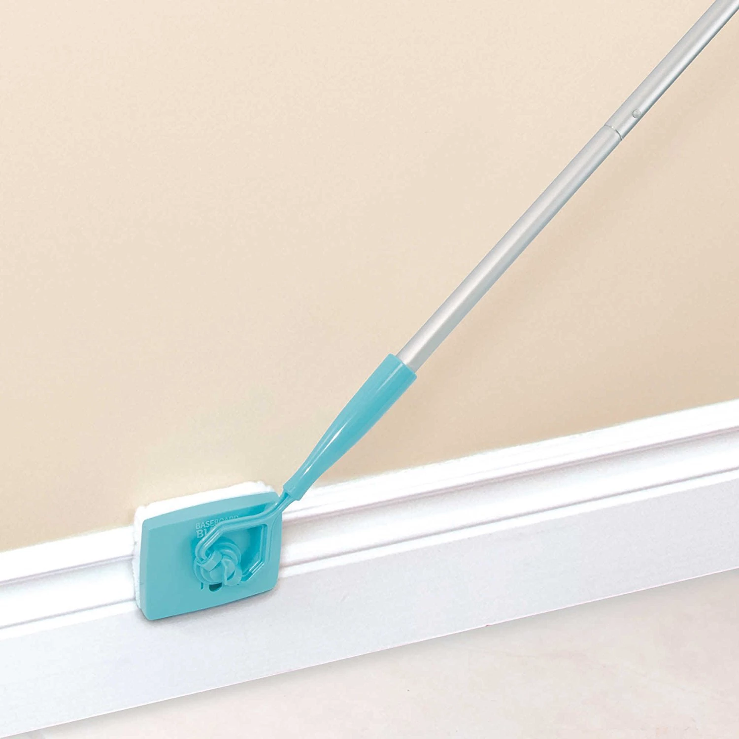 Teal Simba Baseboard Buddy retractable cleaning brush and mop for household use, featuring a universal design for easy home cleaning.