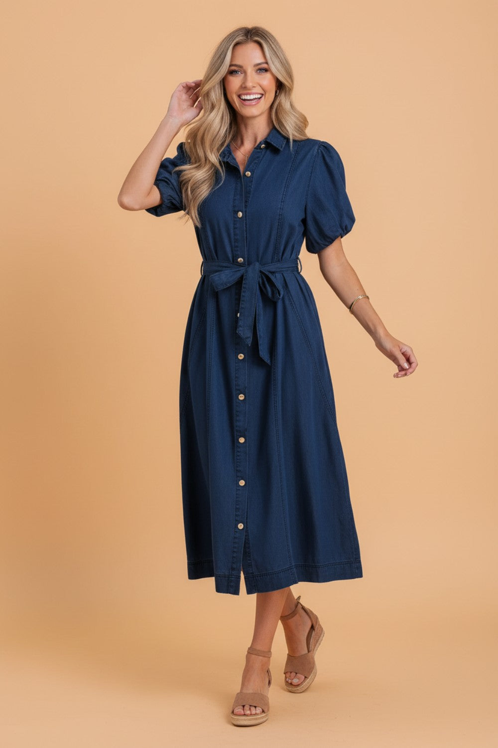 Solid denim midi dress with a collared neckline, bubble sleeves, and button details by Byzantium Bay for women&
