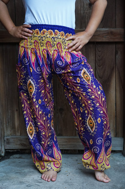 Tan Smokey boho hippie peacock print gypsy pants in vibrant purple with flowing, relaxed fit and bohemian style.