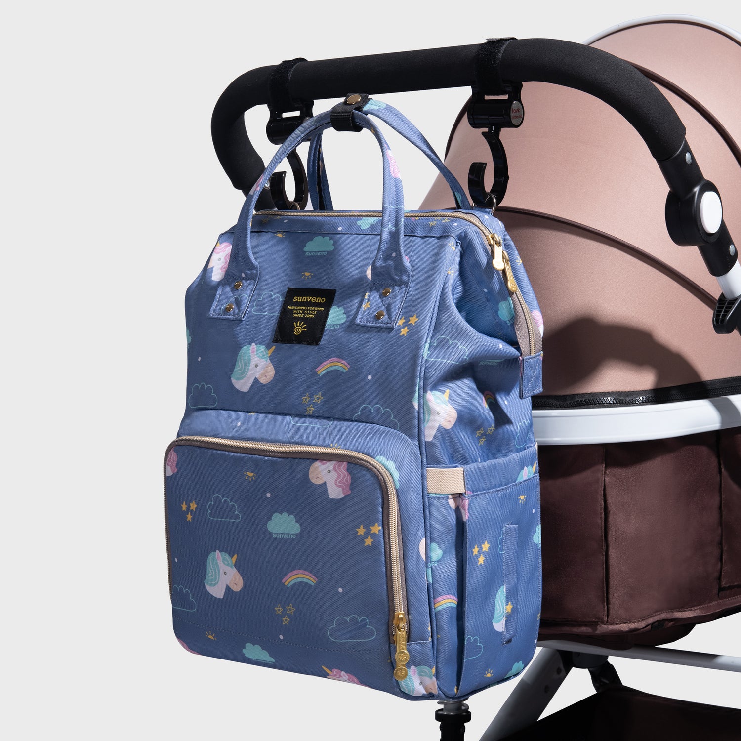 Maroon Chronos fish-opening diaper bag unicorn backpack with multiple compartments and adjustable straps on a white background.