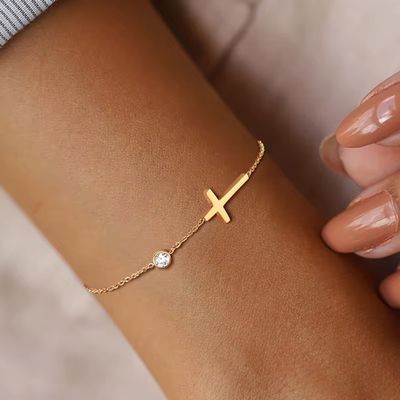 Byzantium Metis faith-based cross bracelet featuring a delicate metal design, perfect for religious or spiritual wear.