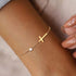 Byzantium Metis faith-based cross bracelet featuring a delicate metal design, perfect for religious or spiritual wear.