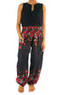 Black floral boho yoga pants for women by Tan Smokey, featuring a flowy, relaxed fit with vibrant flower patterns.