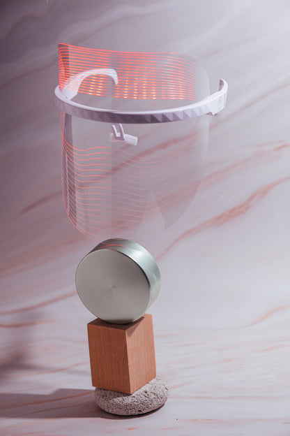 Scarlet Chrysippus Cocoon Skin Enlightenment LED Face Mask showing a sleek black healthcare mask with adjustable straps and LED light panels.
