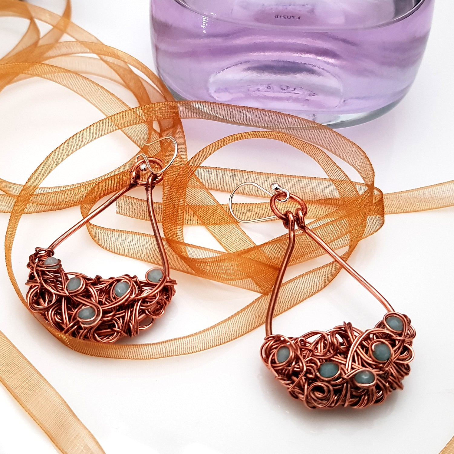 Copper teardrop tangled earrings by Maroon Smudge featuring intricate, handcrafted jewelry with a unique, artistic design.
