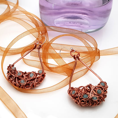 Copper teardrop tangled earrings by Maroon Smudge featuring intricate, handcrafted jewelry with a unique, artistic design.