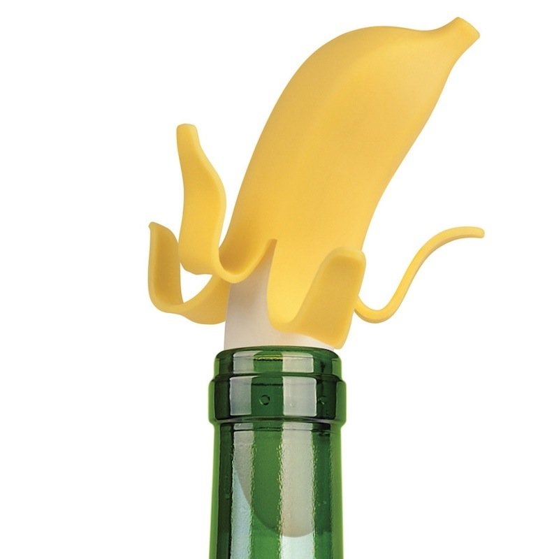 Fuchsia Molly Top Banana Wine Stopper made of colorful ceramic, shaped like a banana, perfect for sealing wine bottles.