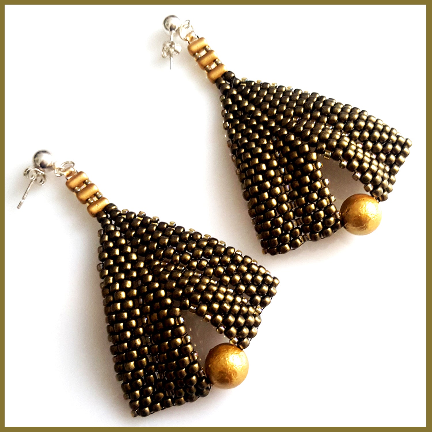 Gold metallic suede and pearl earrings by Maroon Smudge featuring elegant gold pearls and textured metallic suede material.