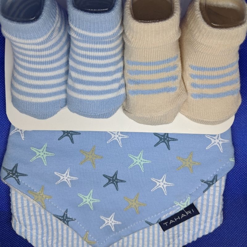 Baby sock and bib set from Ochre Ismene, featuring soft fabric, colorful patterns, and comfortable fit for infants and toddlers.