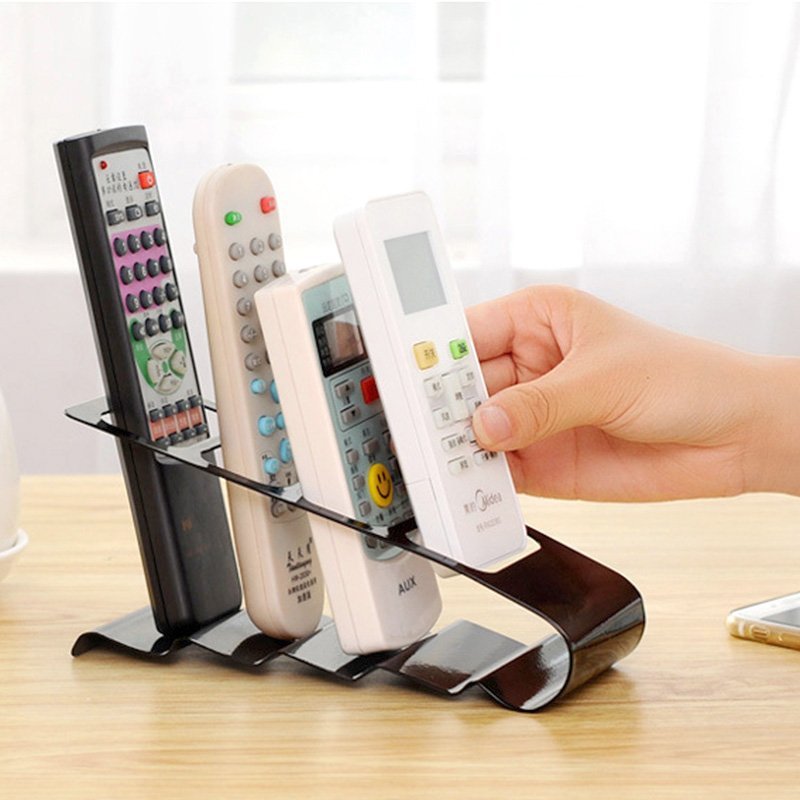 Fuchsia Molly remote controllers organizer with multiple compartments for neat storage of TV and device remotes.