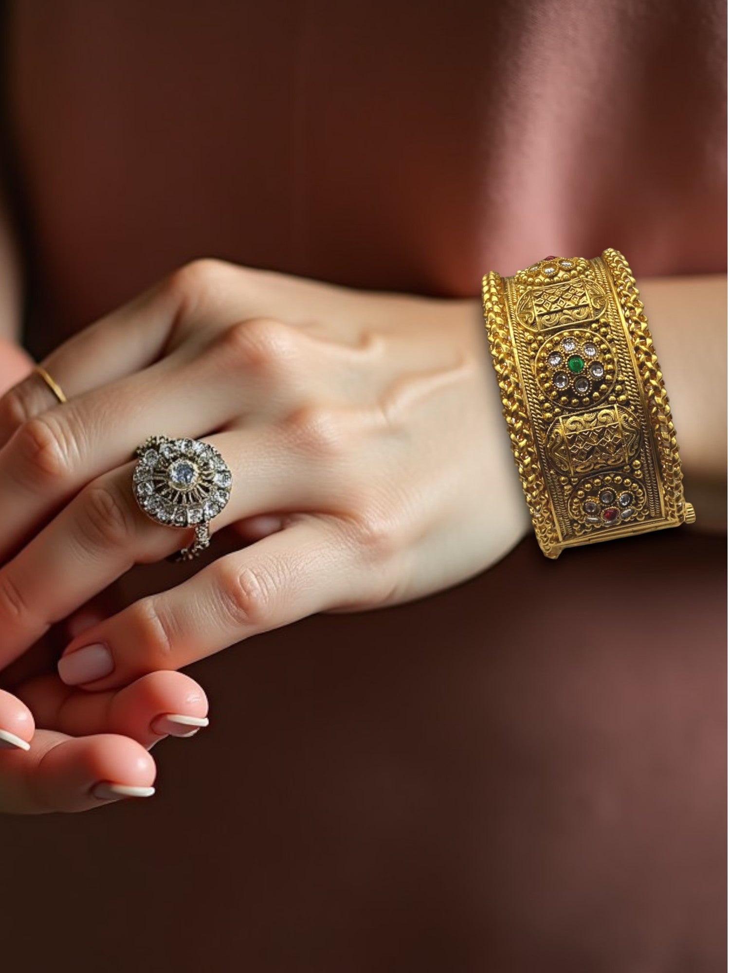 Gold-plated Indian bangle bracelets by Gray Poseidon featuring traditional and modern design elements, detailed close-up shot.