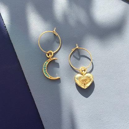 Yellow Athena Crystal Moon Earrings featuring shimmering crystal moons with delicate hooks on a white background.