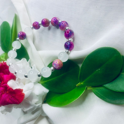 White and purple stone stretch bracelet with silver spacers by Tan Saffron, featuring smooth polished stones and adjustable fit.