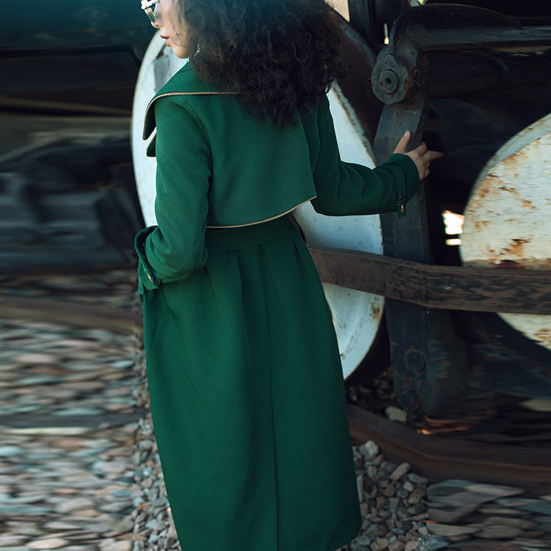 British style double-breasted long coat by Carmine Juneberry, tailored with classic design and warm fabric, shown on a model.