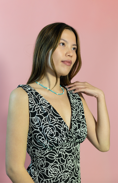 Amber Lemon Ivy V-Neck Dress displayed on a hanger, featuring a stylish V-neckline and flowing fabric in a dress image.