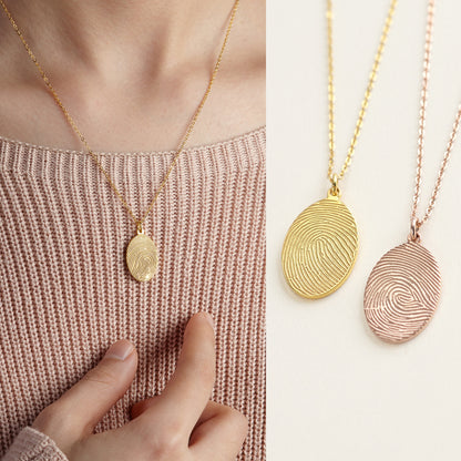 Green Millie fingerprint necklace featuring a memorial thumbprint pendant, showcasing detailed fingerprint engraving on a silver chain.