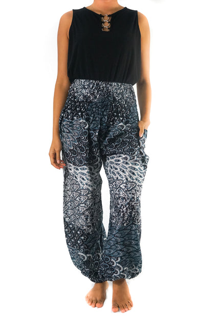 Black peacock print boho pants for women, Tan Smokey yoga and hippie style pants with a relaxed fit and decorative design.