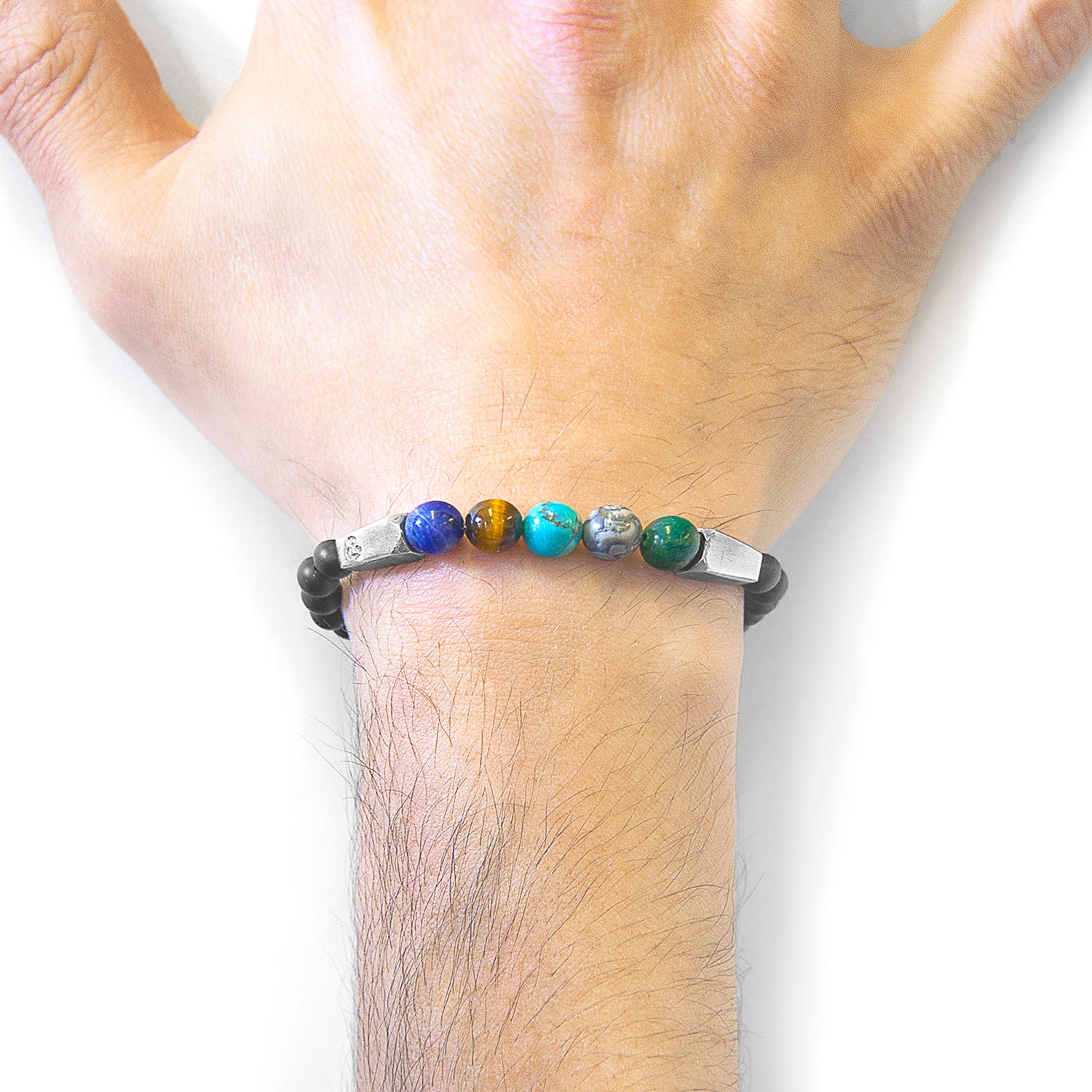 Multicoloured multi-gem Hukou silver bracelet with stones, crafted by Magenta Sooty, featuring vibrant gem accents and silver detailing.