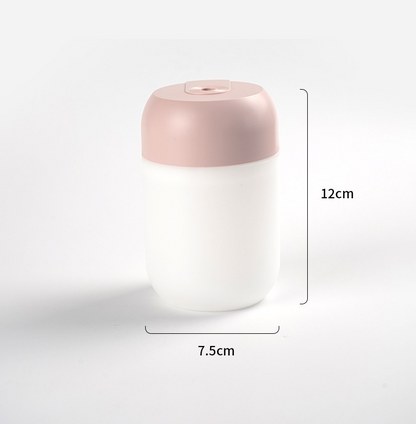 Mini portable ultrasonic air humidifier and aroma essential oil diffuser by Lilac Milo, compact tech accessory with water tank.