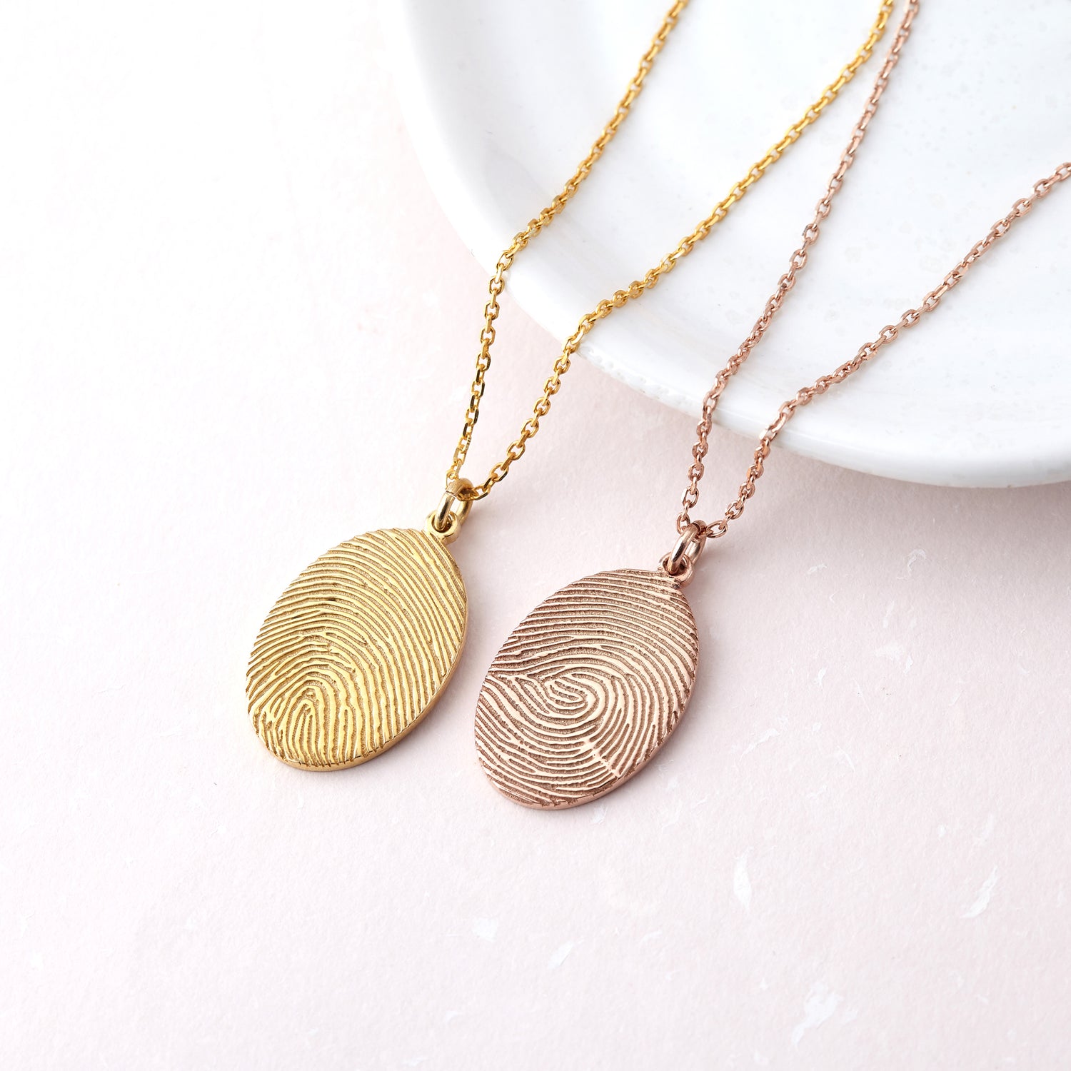 Green Millie fingerprint necklace featuring a memorial thumbprint pendant on a delicate chain, showcasing personalized jewelry design.