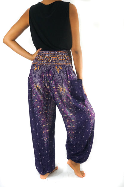 Purple boho harem pants for women by Tan Smokey featuring a peacock pattern and loose, comfortable hippie style.