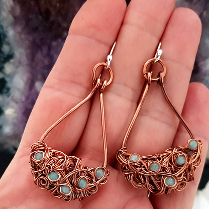 Copper teardrop tangled earrings by Maroon Smudge featuring intricate, twisted design with a warm, metallic finish.