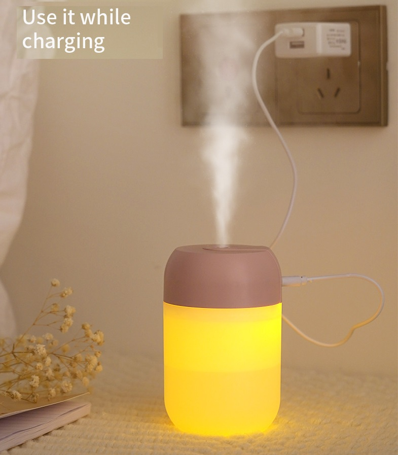 Mini portable ultrasonic air humidifier and aroma essential oil diffuser by Lilac Milo, compact tech accessory with a sleek design.