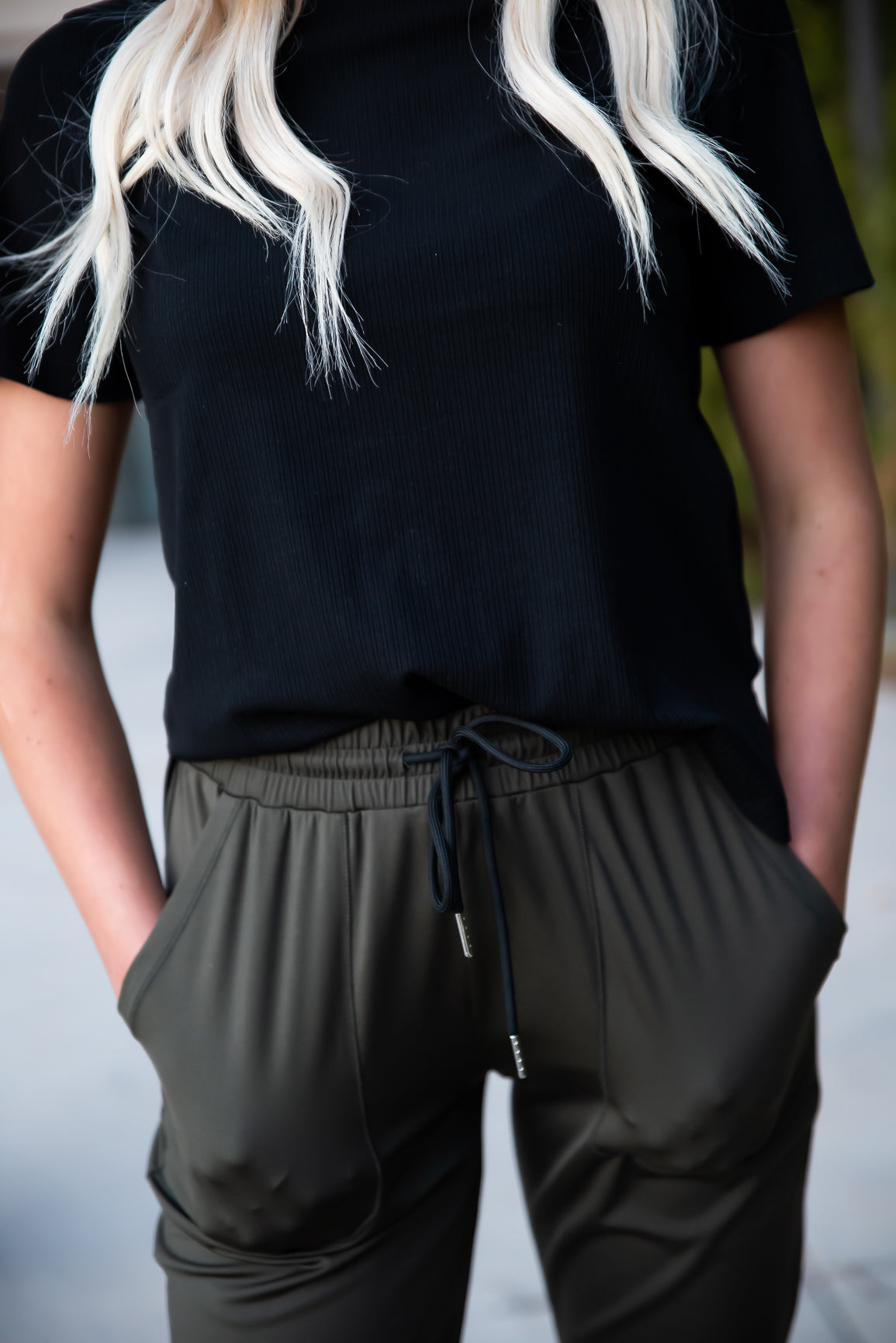 Black DT Alyssa Rib Knit Split Hem Tee by Lavender Danae, featuring ribbed fabric and a stylish split hem detail.