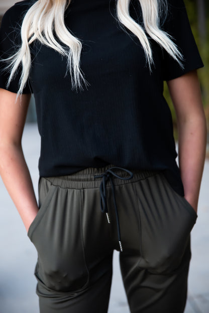 Black DT Alyssa Rib Knit Split Hem Tee by Lavender Danae, featuring ribbed fabric and a stylish split hem detail.