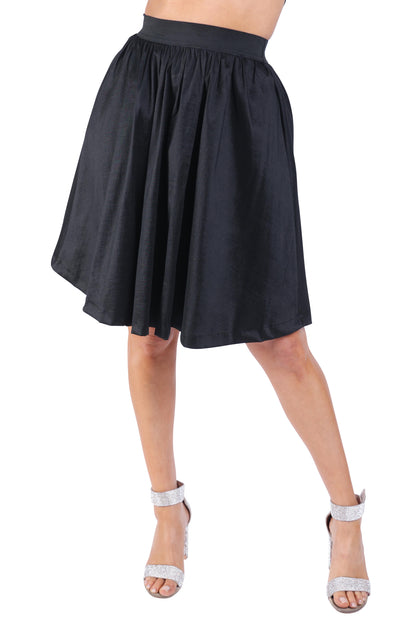 Black pleated midi flare skirt by Puce Juniper featuring casual elastic high waist and a flowing design.