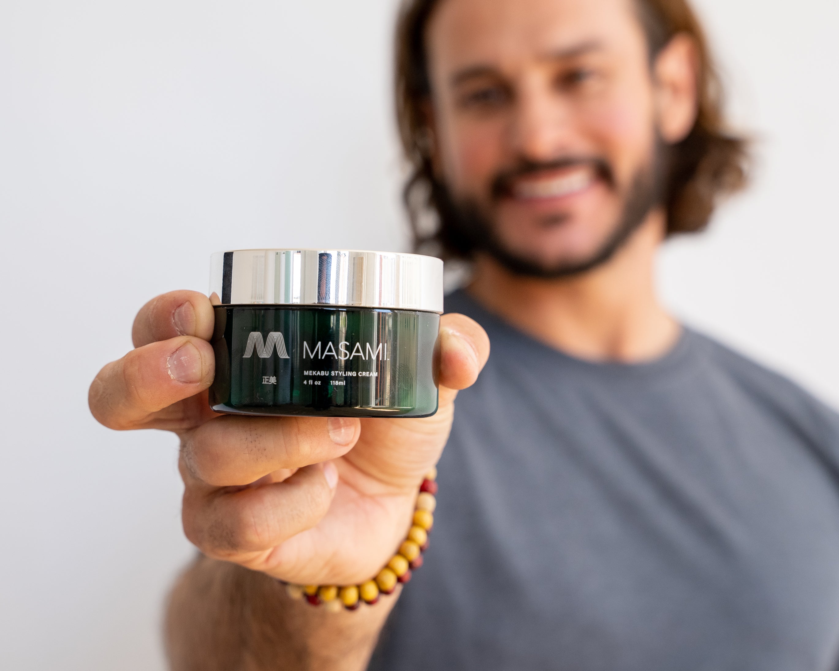 Green Saffron Mekabu Hydrating Styling Cream for hair, showing a jar of the nourishing haircare product.