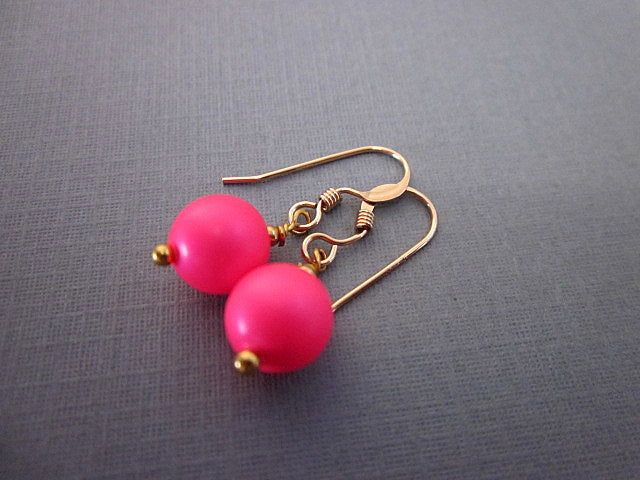 Mint Green Briseis Neon Bead Dangle Earrings featuring colorful beads and silver hooks on a white background.