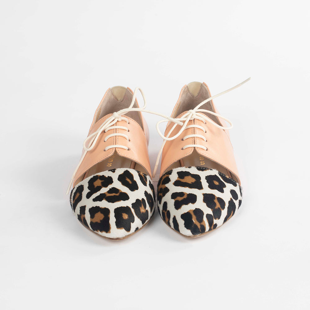 Pink Tulip Sapien calf hair leather flat shoes with pointed toe and slip-on design, highlighting stylish footwear craftsmanship.