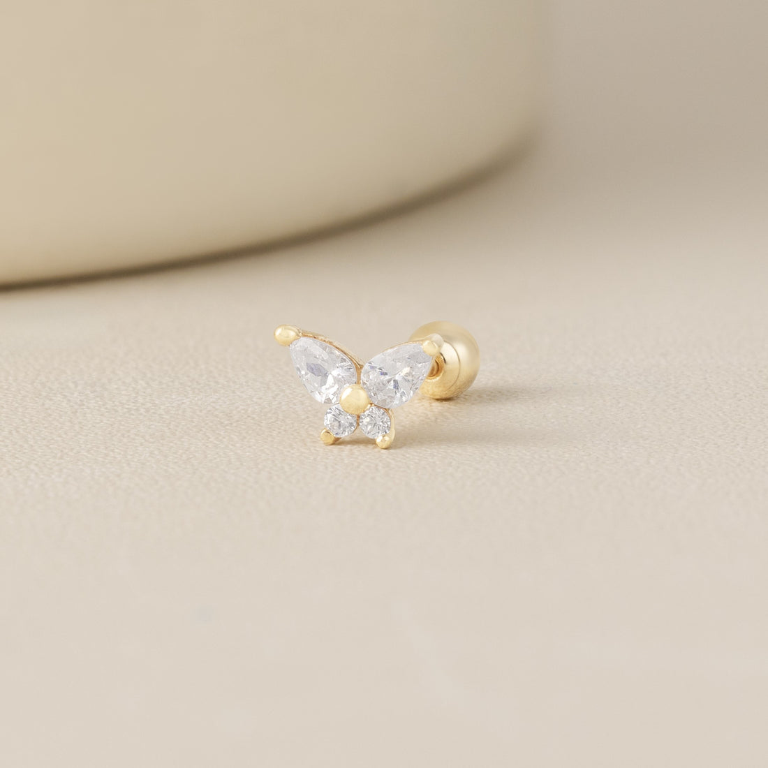 Blue Chrysippus 14K solid gold moth piercing earrings with intricate design, showcasing detailed craftsmanship and a polished finish.
