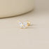 Blue Chrysippus 14K solid gold moth piercing earrings with intricate design, showcasing detailed craftsmanship and a polished finish.