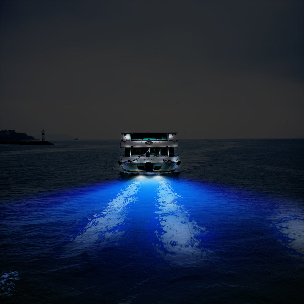 Stainless steel LED underwater pontoon ship light from Teal Simba, mounted on a boat with water reflections visible.