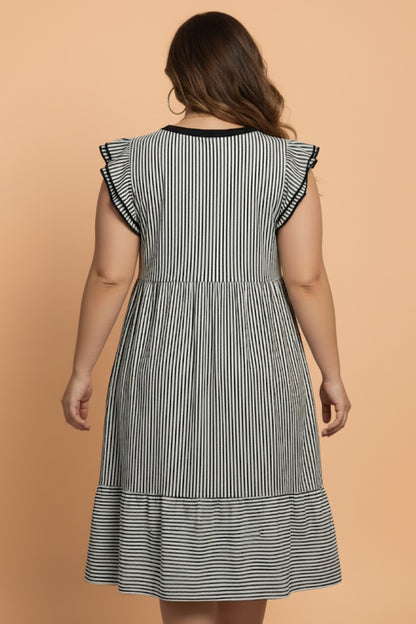 Plus size stripe flutter sleeve V-neck maxi dress by Byzantium Bay, showcasing the flowing fabric and colorful striped pattern.