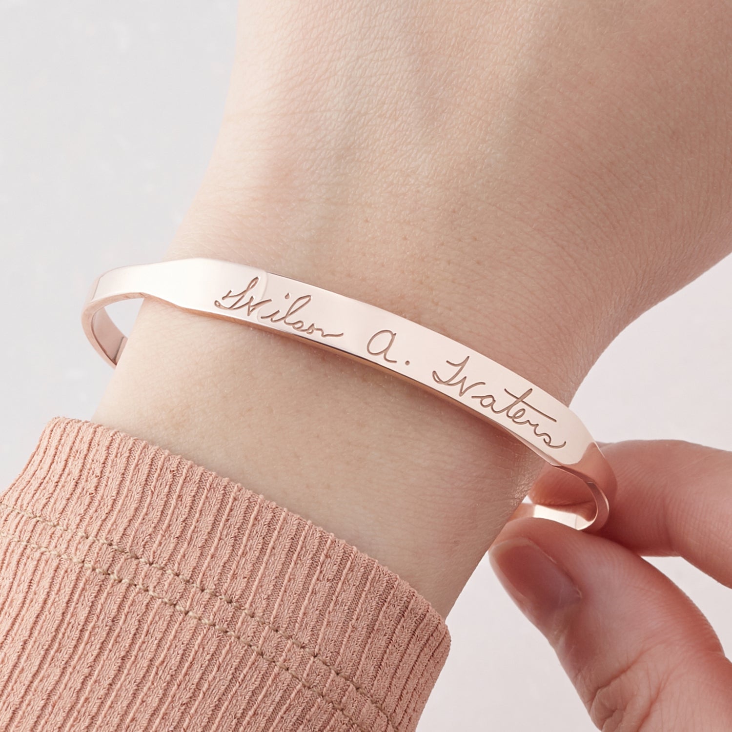 Green Millie handwritten cuff bracelet cufflinks with engraved script, silver-tone metal and detailed design.