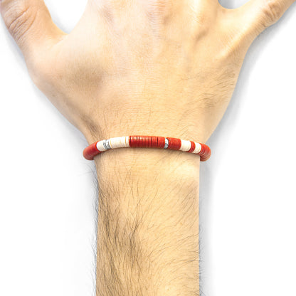 Red Malawi silver and vinyl disc bracelet by Magenta Sooty featuring vibrant red discs and silver accents on a stylish bracelet design.