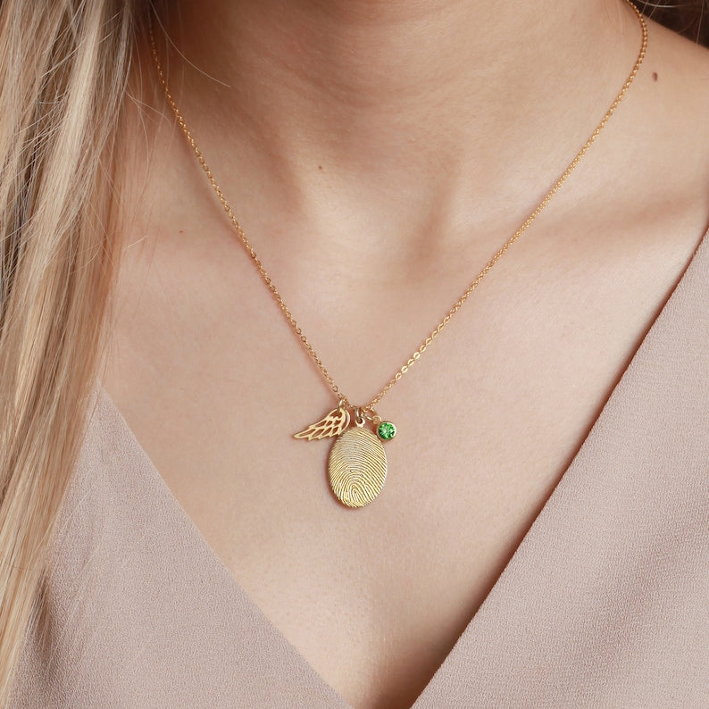 Green Millie fingerprint necklace with personalized fingerprint jewelry and a sparkling birthstone pendant.