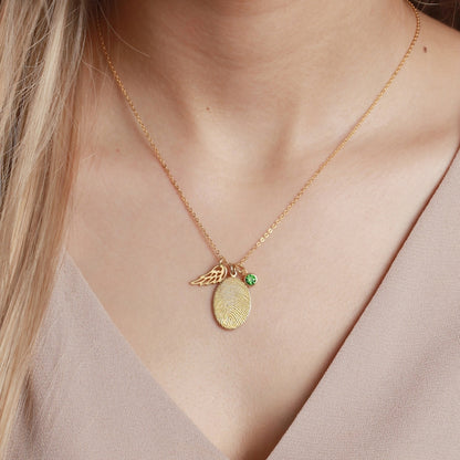 Green Millie fingerprint necklace with personalized fingerprint jewelry and a sparkling birthstone pendant.