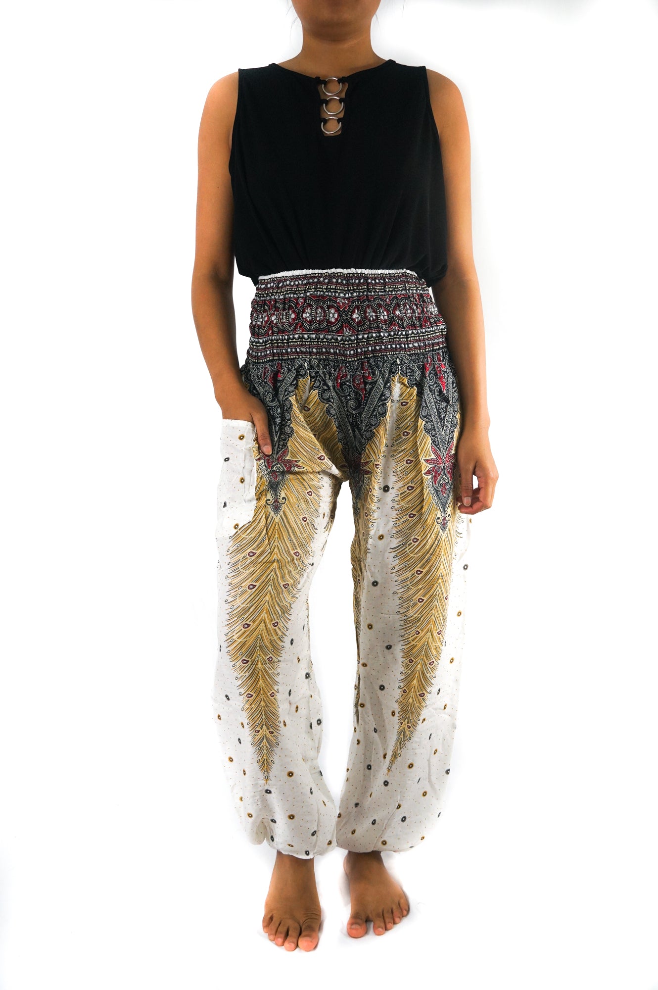 White peacock print boho pants by Tan Smokey, hippie-style yoga pants with a relaxed fit and flowing design.
